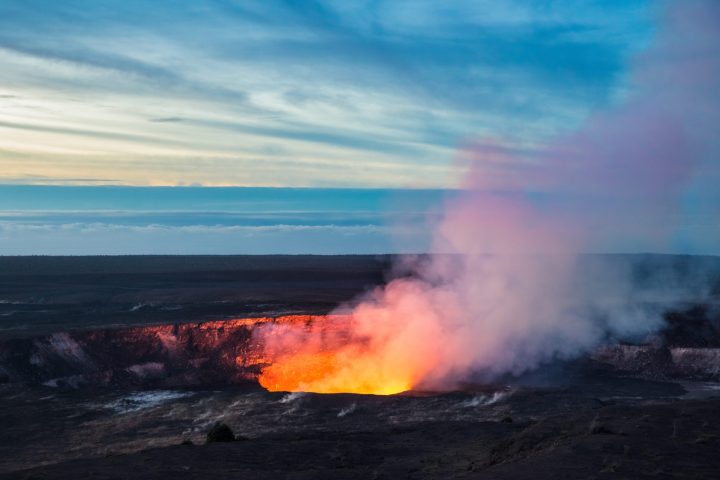 an image of smoke coming out of a volcano