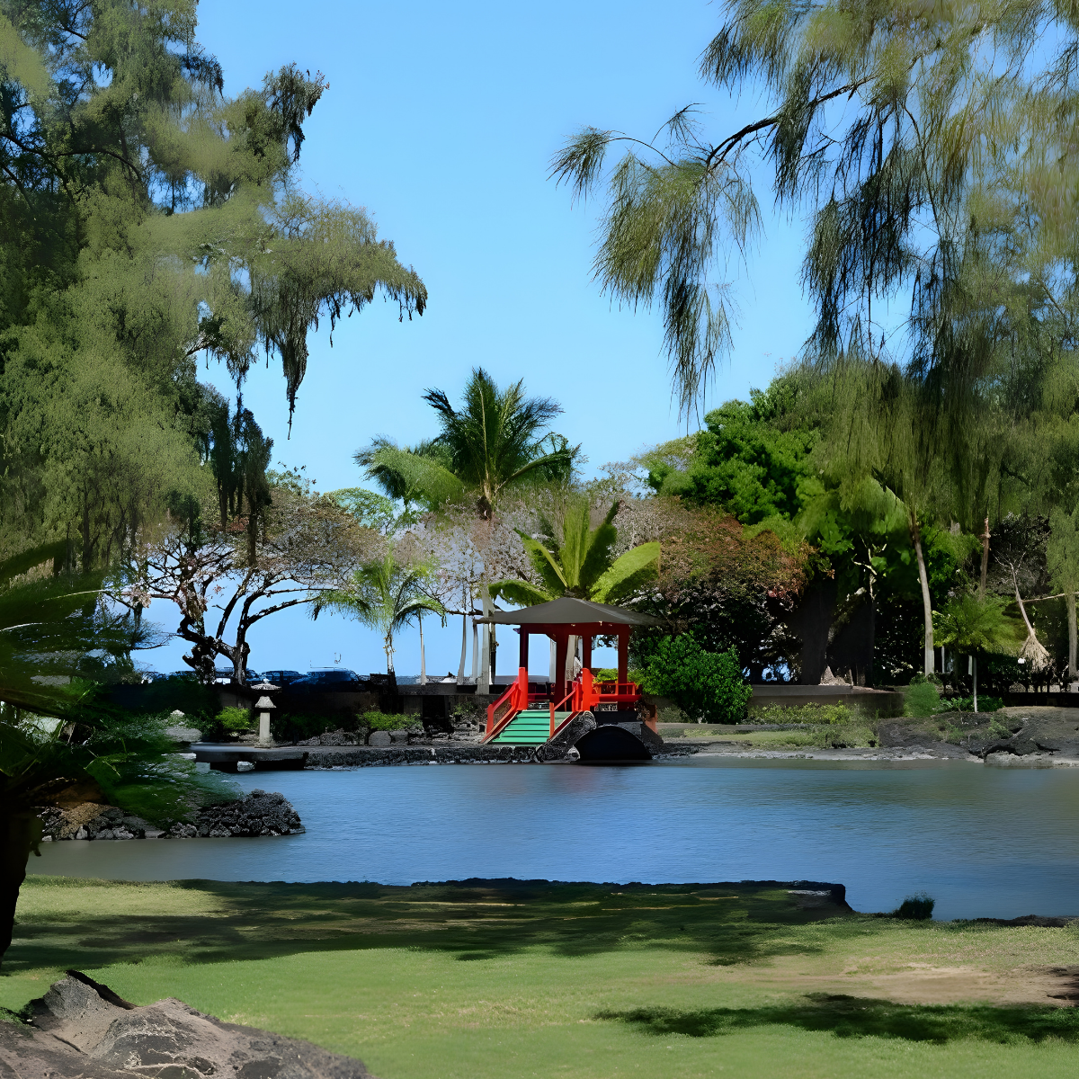 Scenic view of a red gazebo over a pond surrounded by lush trees.
