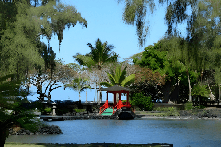 Scenic view of a red gazebo over a pond surrounded by lush trees.