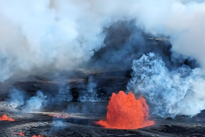 Volcano eruption with smoke and molten lava fountain.
